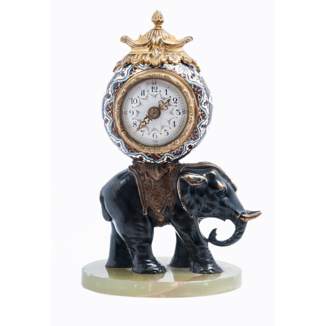 Cute miniature time piece pendulum of a bronze elephant carrying the movement