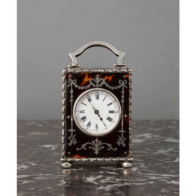 A small English tortoiseshell & silver travelling clock, by William Comyns, circa 1902