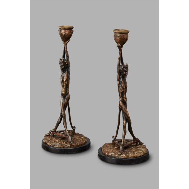 An unusual pair of Art Deco candlesticks featuring Satyrs
