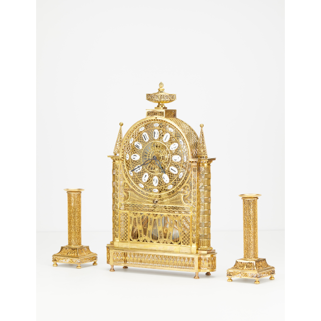 An unusual French Louis XVI filigree skeleton clock set, circa 1780