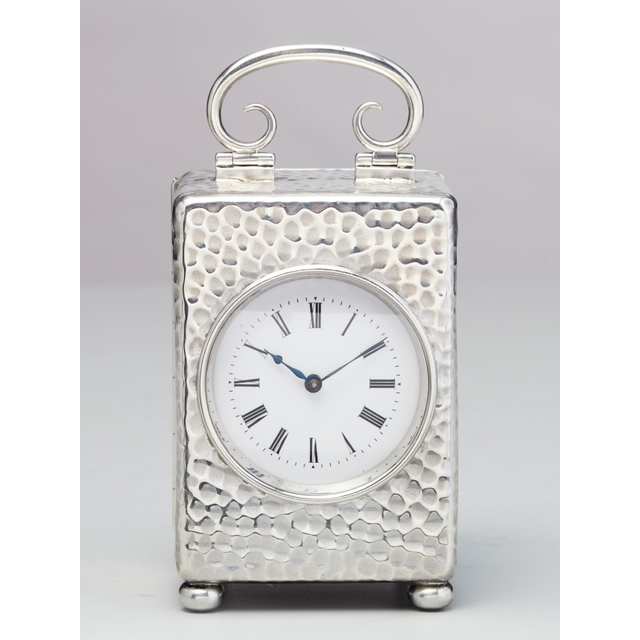 A small English silver travelling clock by William Comyns, circa 1900