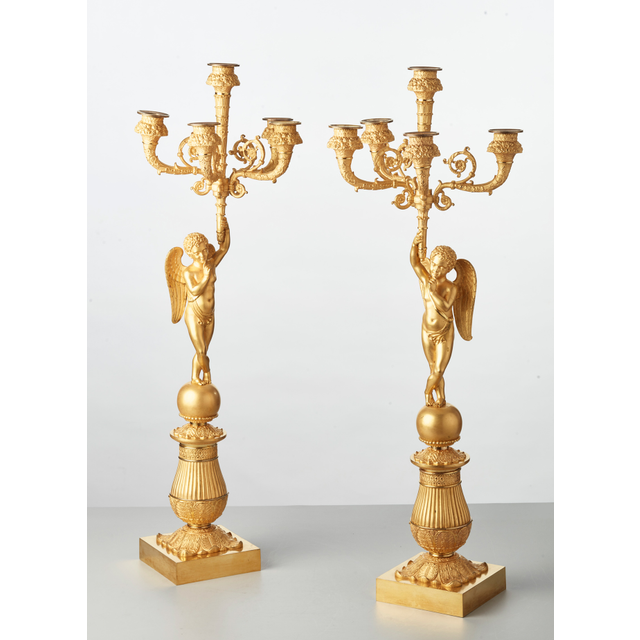 A pair of French bronze five-arm candlesticks with angels, circa 1830