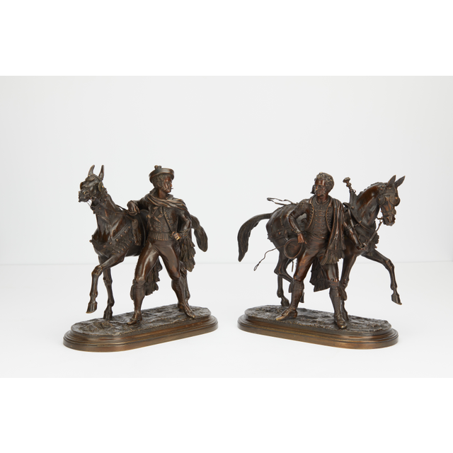 Pair or bronzes of horses with rider