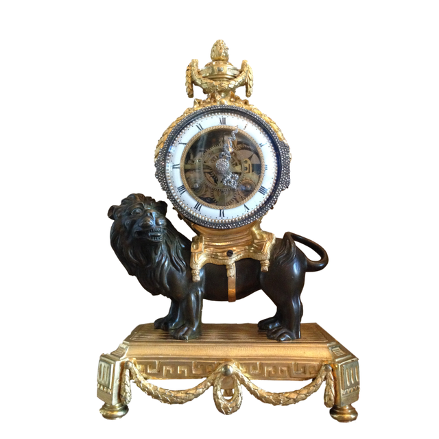 M175 Louis XVI mantel lion clock, with skeletonized clockwork, silver hands and frame on the bezel and striking on a silver bell