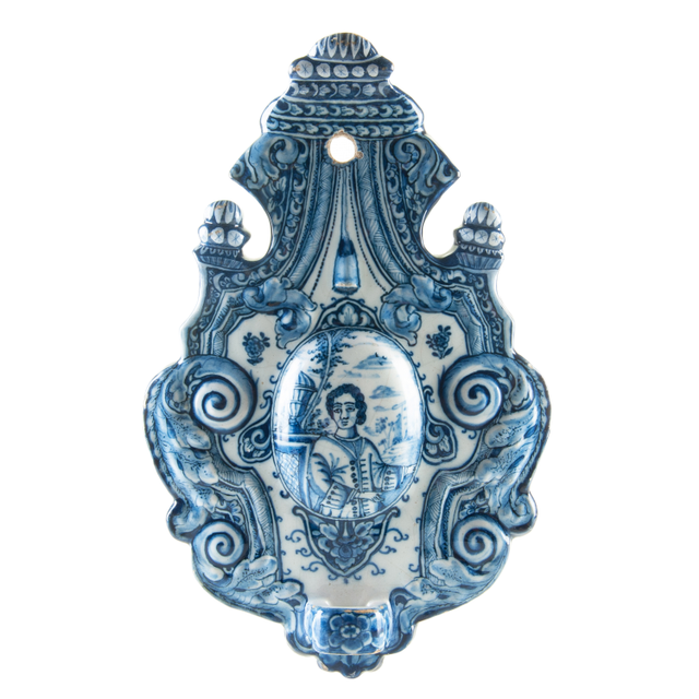 A Blue and White Dutch Delft Earthenware Sconce Decorated with a Figure