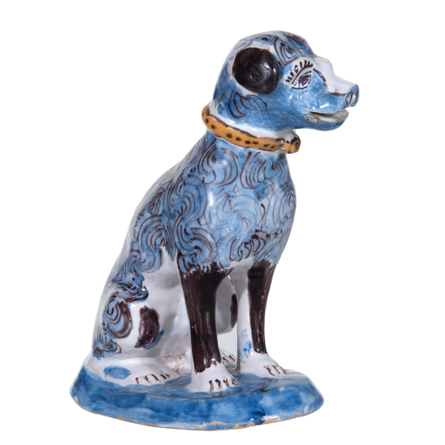 A Polychrome Sitting Dog in Dutch Delftware