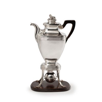 Silver coffee pot on chafing dish