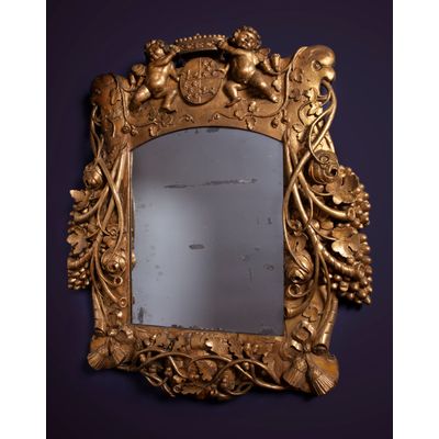 A Louis Quartorze mirror with a coat of arms of VOC governor Cornelis Kien