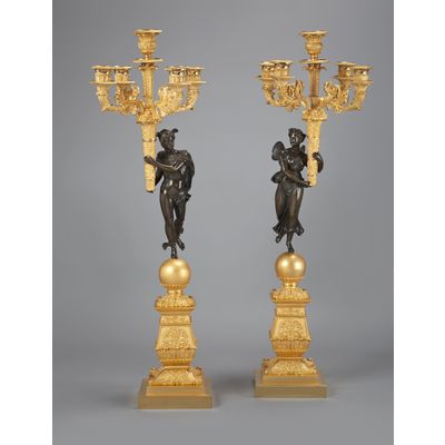 A stunning pair of French Empire gilt and patinated bronze five-light candelabra