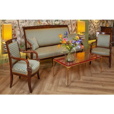 A FINELY CARVED MAHOGANY EMPIRE SOFA “AUX DAUPHINS” AND TWO FAUTEUILS