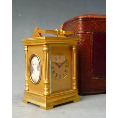 A French miniature carriage clock with two portraits, circa 1880.