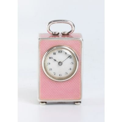 A miniature Swiss silver pink translucent guilloche enamel timepiece, circa 1900.