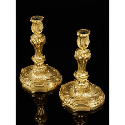 Pair of French Louis XV candlesticks after a design by Juste Aurele  Meissonnier