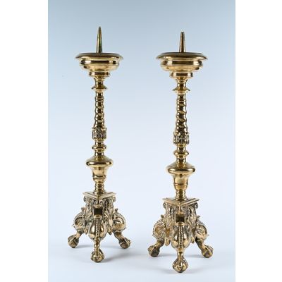 A pair of brass, 17th century candlesticks