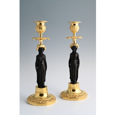 A pair of  ormolu bronze Empire candlesticks