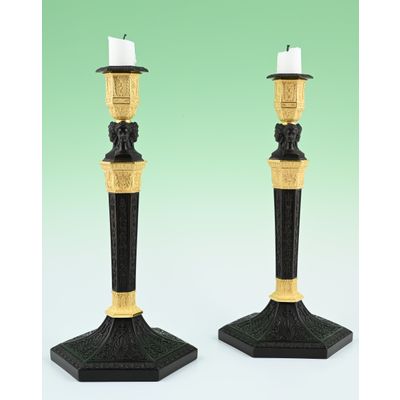 A pair of  ormolu bronze and patineted Empire candle sticks
