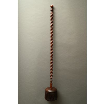 A 17th century brush with round head and twisted handle