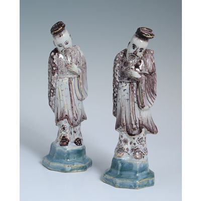 A pair of Delftware chinoiserie sculptures