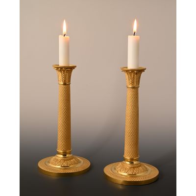 A pair of  ormolu bronze Empire candle sticks