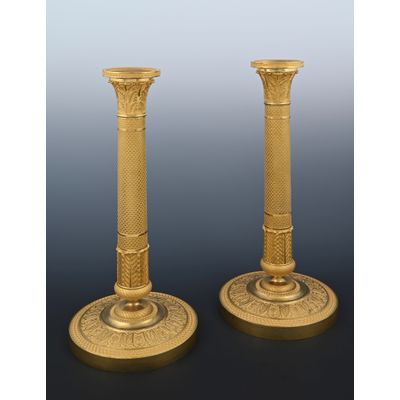 A pair of Empire ormolu bronze candlesticks
