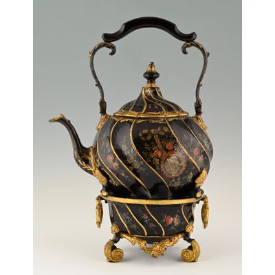 A pewter bouilloire on a stand.