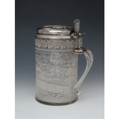 An enamelled glass jug with a silver lid