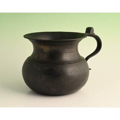 A pewter chamber pot