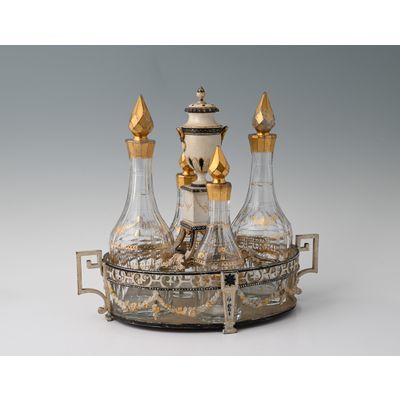 Een gelakt tinnen Hollands olie- en azijnstel