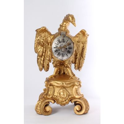 A decorative South German parcel gilt sculptural table clock, circa 1730.