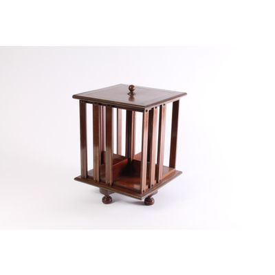 A small English brass inlaid mahogany revolving bookcase, circa 1880.