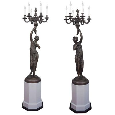 A pair of candlesticks adapted for electricity, circa 1880
