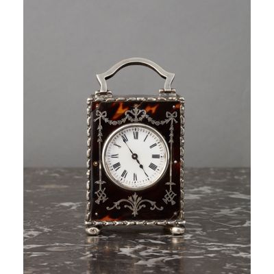 The small English tortoiseshell and silver carriage clock circa 1902