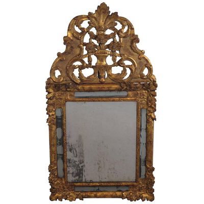 A beautiful French wood carved and original guild Regency wall mirror, 1740