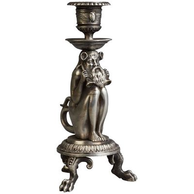 An unusual Silvered candle stick of an old man as fantasy figure, circa 1880