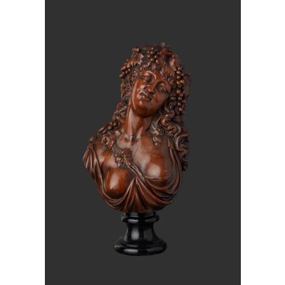 Wood carved bust of Bacchante