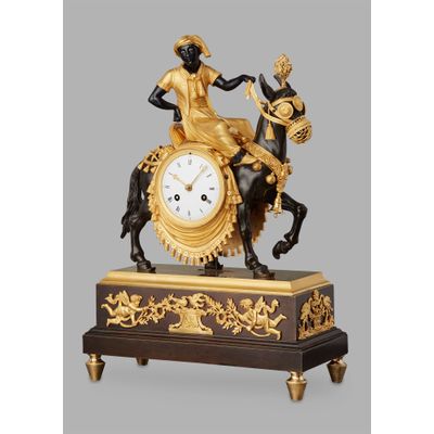 Unusual French ‘Directoire' gilt and patinated bronze mantel clock with young Arab on mule, circa 1800