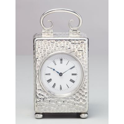 A small English silver travelling clock by William Comyns, circa 1900