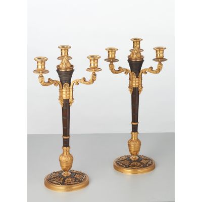 A rare pair of European four-light gilt bronze ‘Directoire’ candlesticks, circa 1810