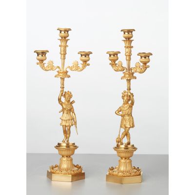 A pair of French bronze ‘Paul and Virginie’ candlesticks, circa 1830