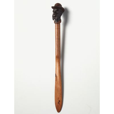 An American coloured wood ‘dandy face’ letter opener, circa 1880