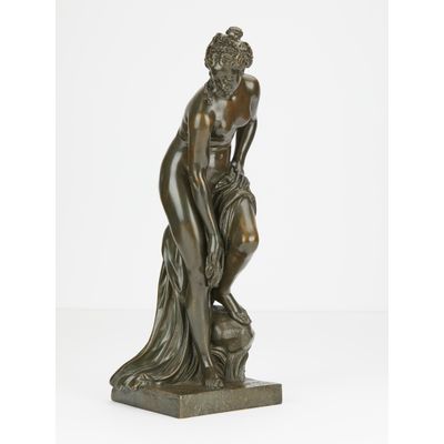Elegant naked bronze statue
