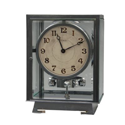 M127 Nickel five glasses ATMOS Clock champagne coloured  dial, Arabic numerals. On the back numbered 6972 and signature Brevet J.L. Reutter, S.G.D.G., made in Paris.