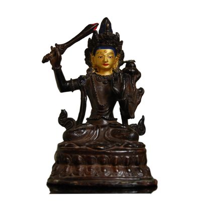 Oda 36 Chino-Tibetan gilt bronze figure of a deity