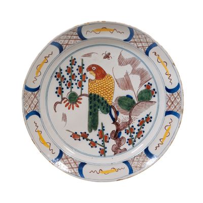 A Polychrome Dutch Delft Charger Depicting a Parrot