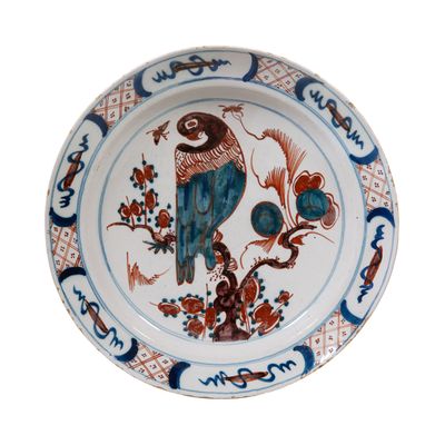 A Polychrome Dutch Delft Charger Depicting a Parrot
