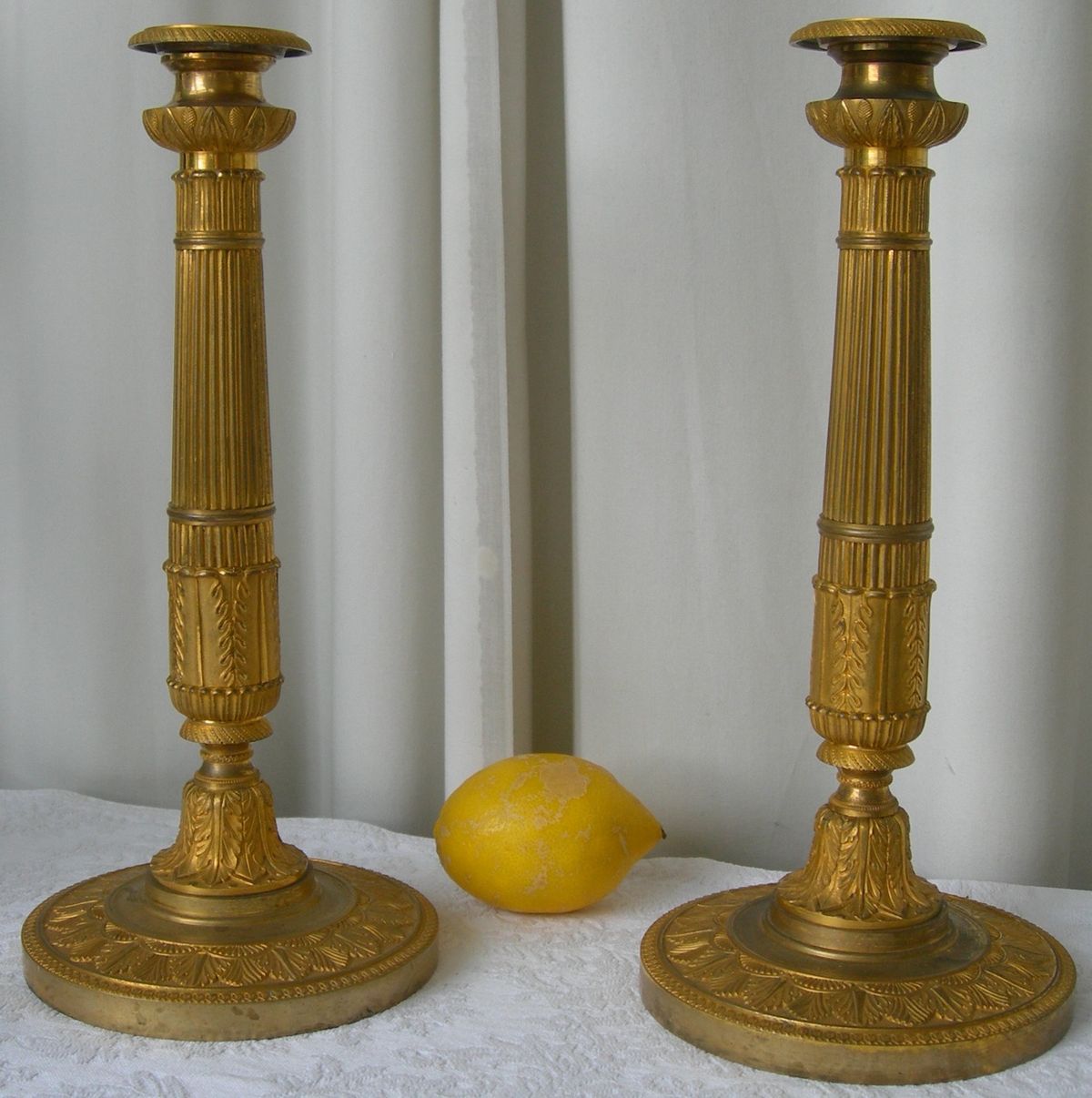 A PAIR OF FIRST EMPIRE CANDLESTICKS