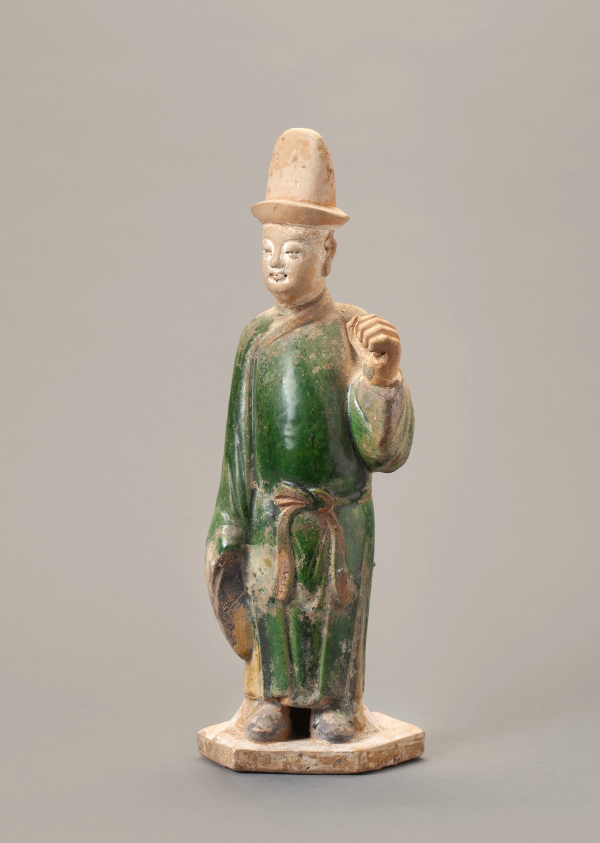 A Chinese green-glazed pottery figure of a tomb attendant