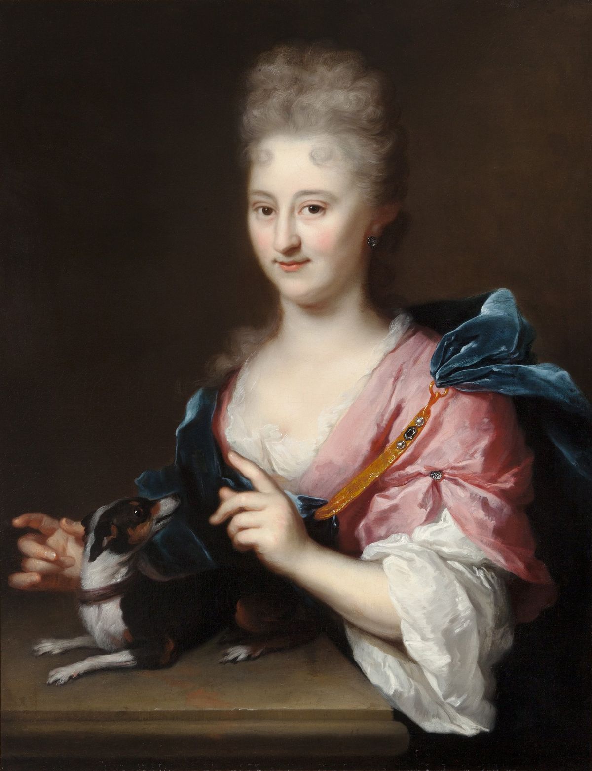 ARNOLD BOONEN (DORDRECHT 1669-1729 AMSTERDAM) – A PORTRAIT OF A LADY IN A PINK DRESS AND BLUE CLOAK WITH A LAP DOG