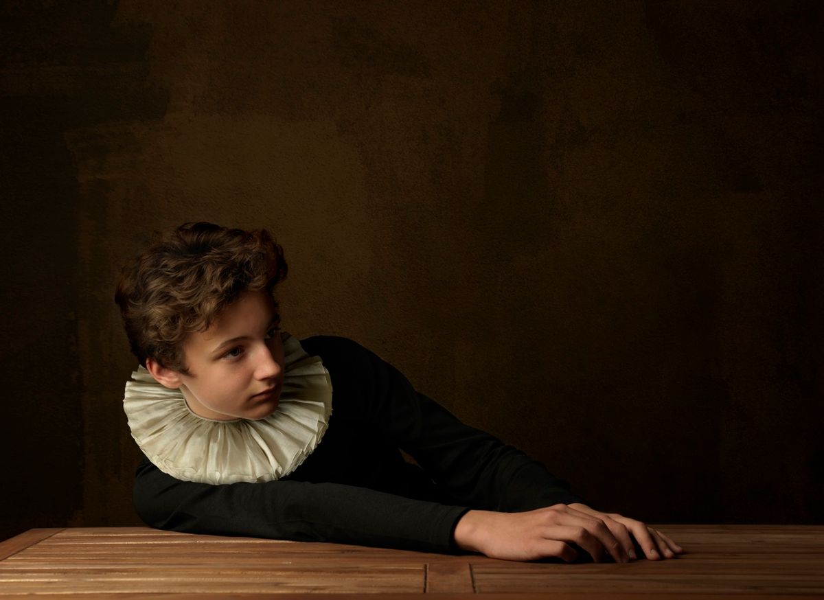 Boy with White Collar at Table