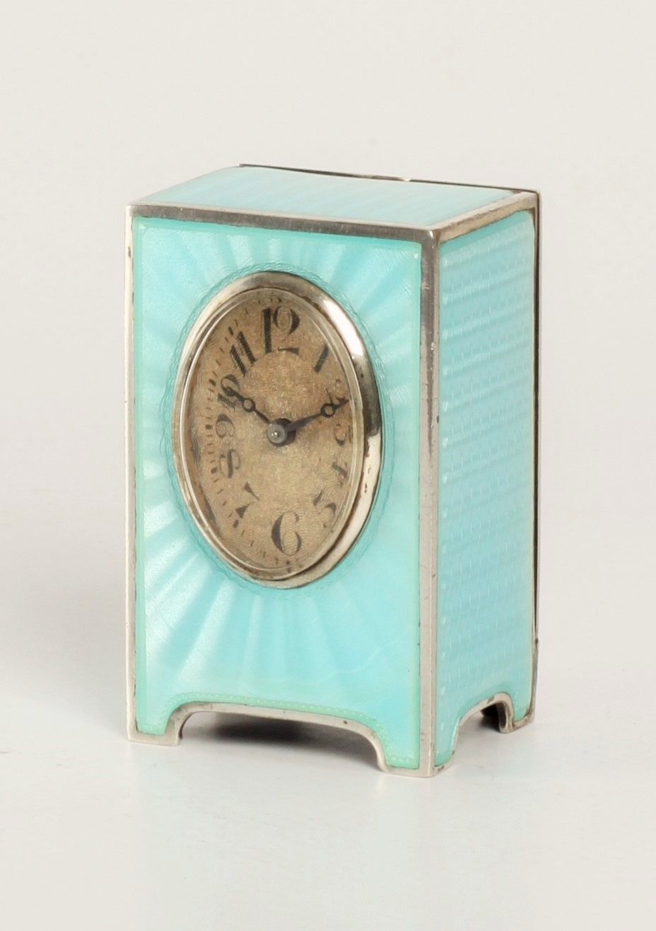 A miniature Swiss silver light blue guilloche translucent enamel timepiece, circa 1900 - image 1